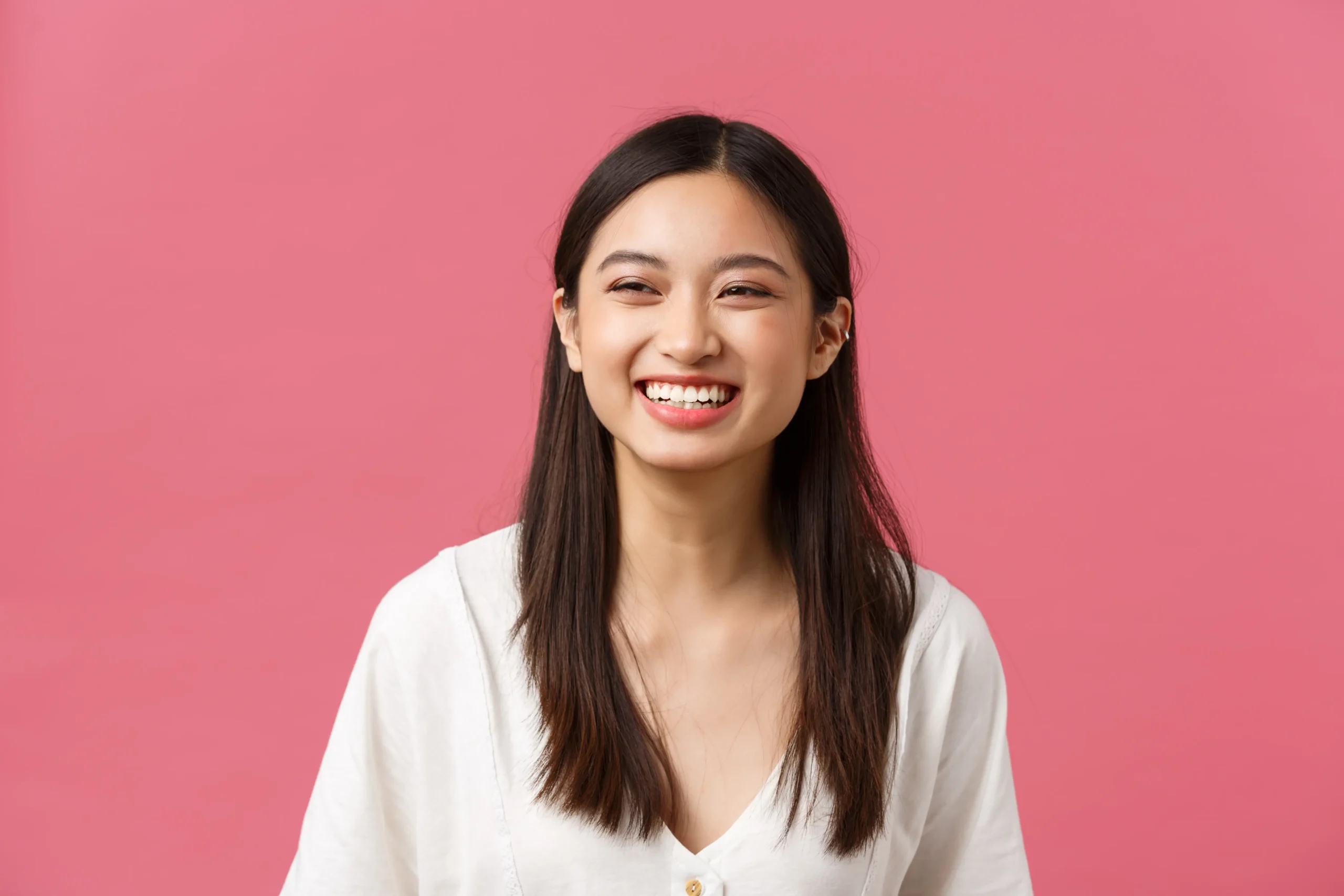 beauty-people-emotions-summer-leisure-concept-joyful-carefree-laughing-asian-woman-enjoying-summertime-standing-pink-background-smiling-lively-having-positive-mood-scaled